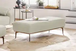 W.SCHILLIG Polsterhocker run, mit Holzsockel, Füße in Bronze pulverbeschichtet, Breite 150 cm