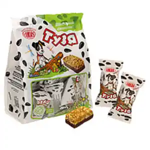 Sonnenblumenkernen-Krokant teilweise in kakaohaltiger Fettgl...