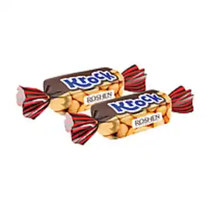 Konfekt mit Erdnüssen (34%) und Karamell (38%) überzogen mit...