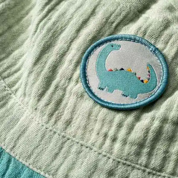Bild 2 von ALANA Hut aus Musselin mit Dino-Motiv, grün, Gr. 50/51, 1 St